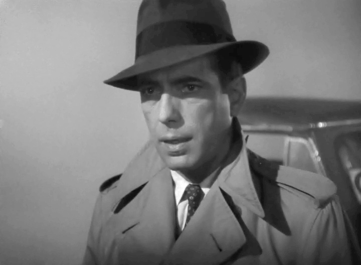 1940s Men's Fashion: Portraying Rick Blaine in Casablanca (1942), actor Humphrey Bogart made an impression in a trench and fedora as one of the most memorable visuals of the era.