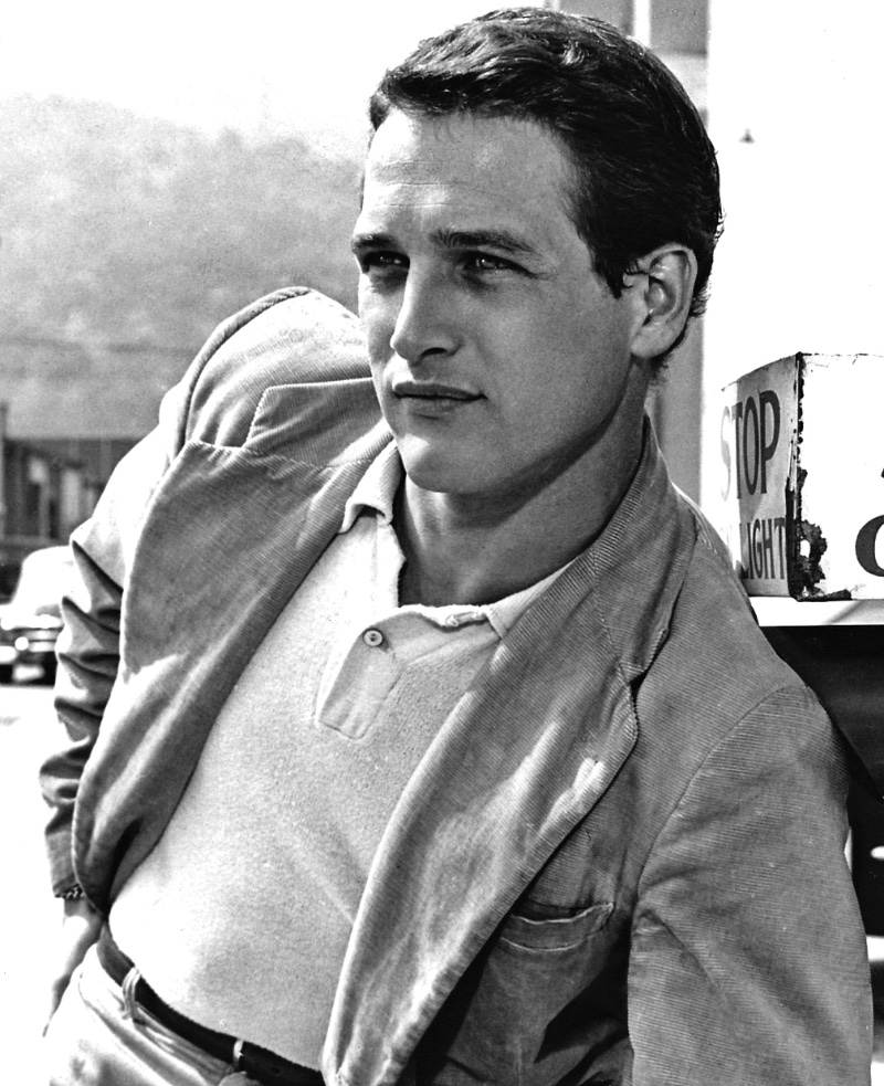 Paul Newman wears a relaxed-cut sport coat with a polo in a 1954 promotional image.