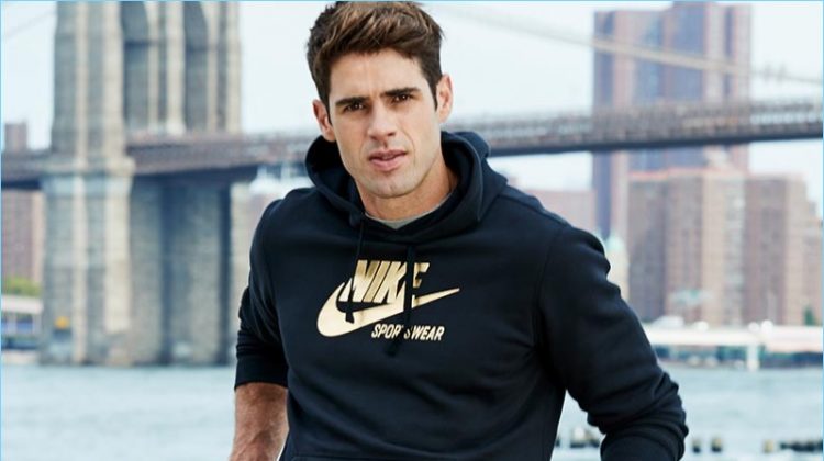 Chad White sports a Nike metallic logo sweatshirt from Macy's.