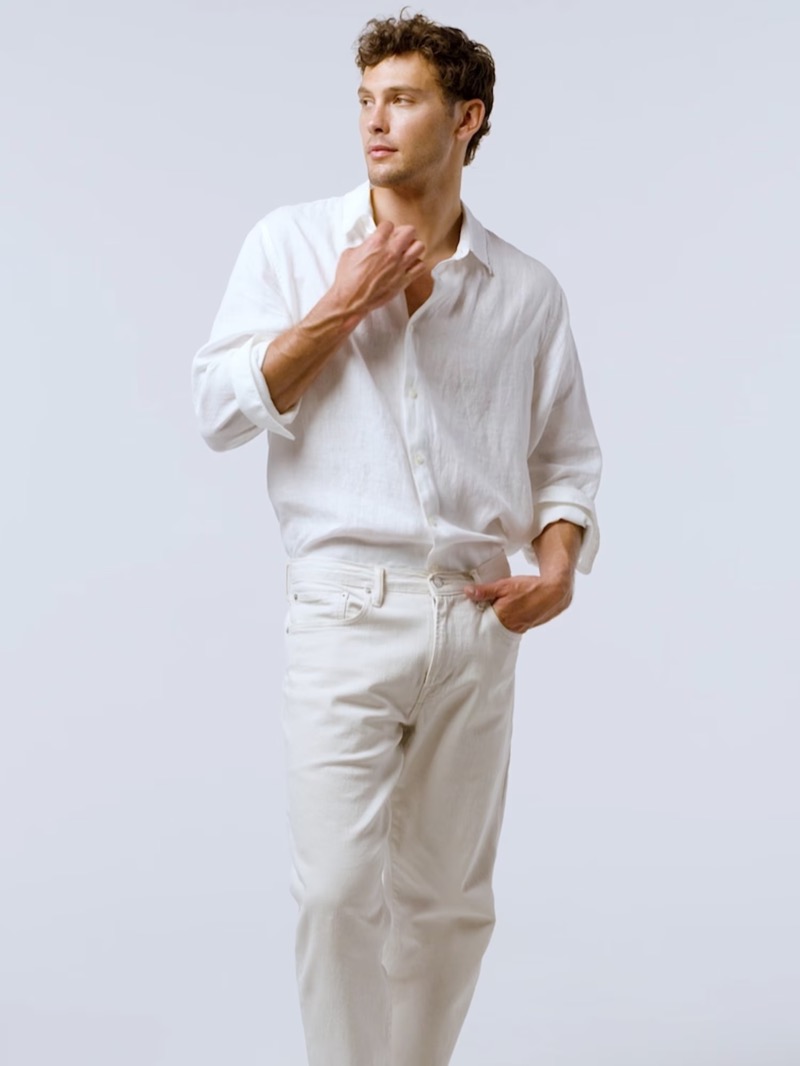 A smart summer vision, Cooper Koch sports Gap's long-sleeve linen shirt, ribbed tank, and straight jeans.