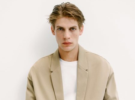 Relaxed tailoring is front and center as Baptiste Radufe wears a tan suit from Zara Man.